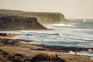 Awlrm Collection: Surfers in El Cotillo coastline, Fuerteventura, Canary Islands. Spain