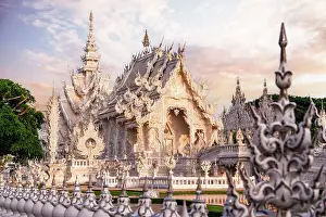 Craft Prints: Surreal architecture and decorated fence at Wat Rong Khun (White Temple) at sunrise