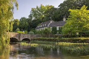 The Swan Hotel on the banks of the River Coln at Bibury in the Cotswolds, Gloucestershire The Swan Hotel on the banks of the River Coln at Bibury in the Cotswolds, Gloucestershire