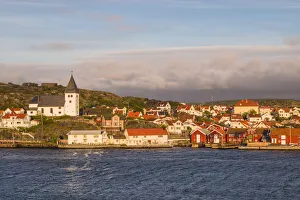 World Location Prints: Sweden, Bohuslan, Tjorn Island, Skarhamn, town skyine with Skarhamn church, sunset