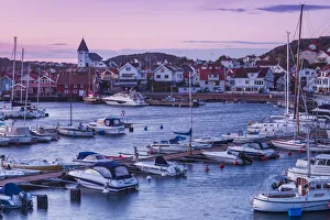 Sweden, Bohuslan, Tjorn Island, Skarhamn, town skyiine with Skarhamn church, dusk
