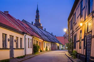 Sweden Prints: Sweden, Southern Sweden, Ystad, Old Town street with view of Sankta Maria kyrka church
