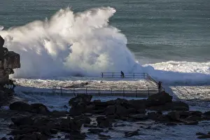 Sydney Prints: Swimmer braces as waves crash over rocks at North Curl Curl rockpool, New South Wales