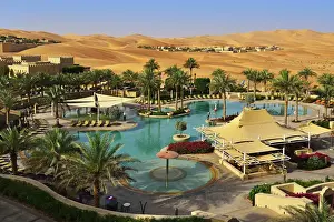 Norbert Eisele Hein Prints: The swimming pool of the desert luxury hotel Anantara Qasr Al Sarab in the Empty Quarter