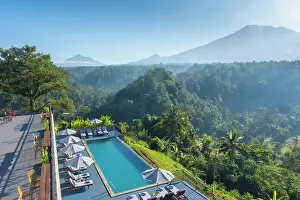 Volcano Prints: Swimming pool at Tapa Agung View Hotel with Mount Agung volcano (highest mountain in Bali) Bali
