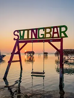 Sun Rays Prints: Swing Bar at sunset, Secret Beach, Ambergris Caye, Belize District, Belize