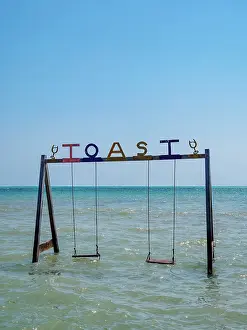 Cayo Ambergris Prints: Swing at the TOAST Seaside Boozery and Grill
