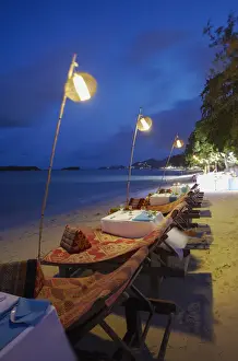 Dining Prints: Tables set for dinner at Amari Palm Reef on Chaweng beach at dusk, Ko Samui, Thailand