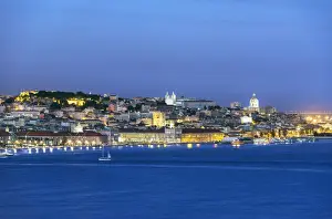 The Tagus river (Tejo river) and the historic centre of Lisbon at twilight. Portugal