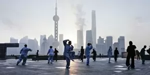 Images Dated 6th November 2016: Tai Chi on The Bund (with Pudong skyline behind), Shanghai, China