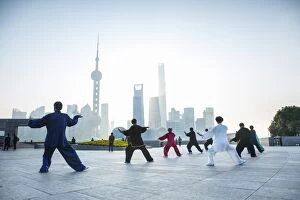 Images Dated 11th November 2014: Tai Chi on The Bund (with Pudong skyline behind), Shanghai, China