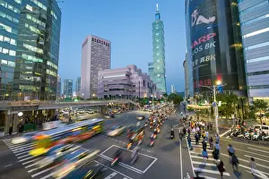 Downtown District Prints: Taiwan, Taipei, traffic in front of Taipei 101 at a busy downtown intersection in
