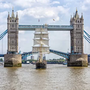 Suspension Bridge Collection: Tall Ship Thalassa passing through the Tower Bridge, London, England