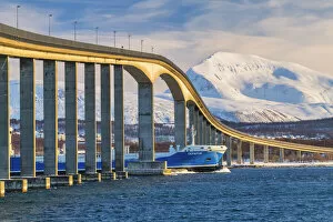 Tanker Going Under Bridge & Tromsdalstindon in Winter, Tromso, Norway