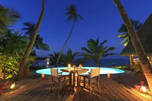 Beach Resort Prints: Tanzania. Zanzibar, Kigomani, table for private dinner set at the edge of infinity