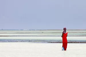 Images Dated 7th March 2012: Tanzania, Zanzibar, Unguja, Pongwe. A lady looks out to sea