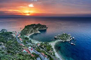 Mediterranean Area Prints: Taormina, Sicily. Elevated view of Isola Bella in Taormina with the sun rising
