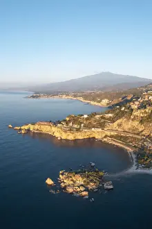 Taormina, Sicily, Italy. Coastal aerial landscape and Mount Etna in the backdrop