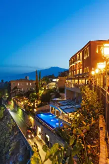 Etna Prints: Taormina, Sicily. Luxury hotel by night with Etna volcano in the background