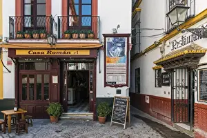 Corner Prints: Tapas restaurant in the primary tourist neighborhood of Santa Cruz in Seville, Andalusia