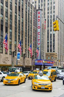 Taxi cabs outside Radio city, New York, USA