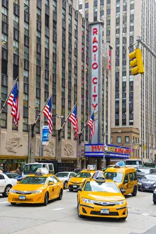 5th Avenue Prints: Taxi cabs outside Radio city, New York, USA