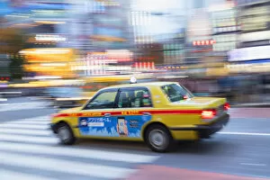 Taxi passing through Shibuya Crossing, Shibuya, Tokyo, Japan
