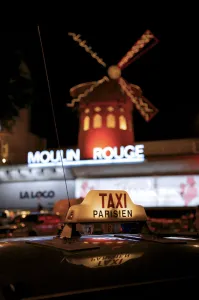 Images Dated 10th October 2008: Taxi sign with Moulin Rouge in background, Paris, France