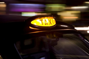 Taxicab at night, London, UK