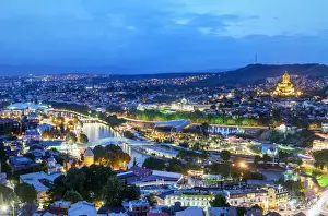 Tsminda Sameba Prints: Tbilisi and the Mtkvari river at dusk. On the right the Holy Trinity Cathedral (Tsminda