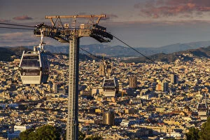 Images Dated 28th February 2014: Teleferic de Montjuic or aerial tramway with city skyline at sunset, Barcelona, Catalonia