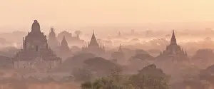 Pagodas Prints: Temples and pagodas in a misty valley at dawn