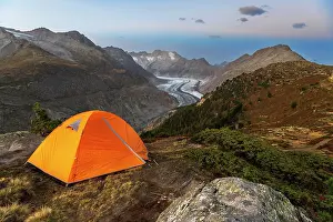 Wallis Prints: Tent of hiker standing on top of a hill overlooking the Aletsch glacier