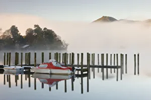 Tethered boats on Derwent Water on a misty morning, Lake District National Park, Cumbria