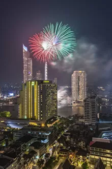 Images Dated 23rd August 2018: Thailand, Bangkok, Riverside Area, high angle skyline view with fireworks, dusk