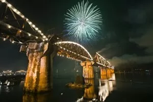 Festivity Gallery: Thailand, Kanchanaburi, Kanchanaburi. Fireworks over Death Railway Bridge
