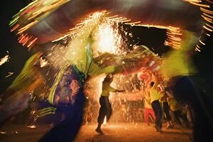 Performance Gallery: Thailand, Ko Phuket, Phuket. Dragon dancers and fireworks during the Phuket Vegetarian Festival