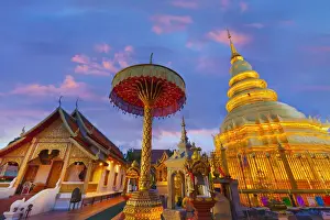 Parasol Prints: Thailand, Lamphun, Wat Phrathat Haripunchai Woramahawihan, temple at dusk