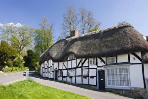 Thatched Cottages Prints: Thatched cottages in the village of Wherwell, Hampshire, England. Spring (April) 2009