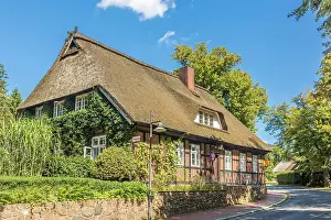 Half Timbering Prints: Thatched historic half-timbered house in the village of Jesteburg