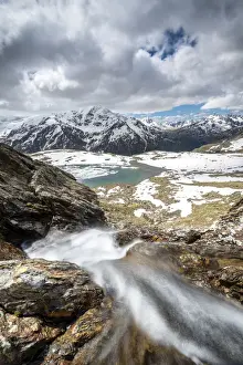 Thaw Prints: The thaw of Lake Manzina, Pizzo Tresero in backgroung in Valfurva valley, Valtellina