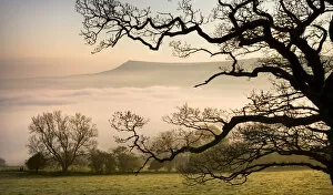 Powys Gallery: A thick blanket of early morning mist covers the landscape below Mynydd Troed in the