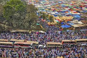 Prayers Prints: Thousands of Muslims kneel in the middle of a busy road junction to pray