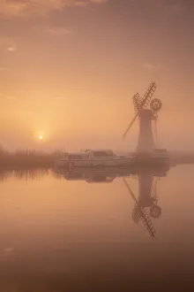 Thurne Mill Reflecting in River Thurne at Sunrise, Norfolk Broads National Park, Norfolk, England
