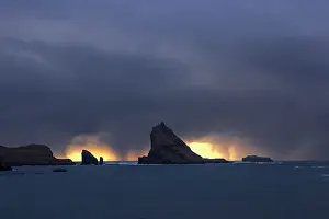 Foroyar Prints: Tindholmur islet and Drangarnir sea stacks in a stormy day at sunset