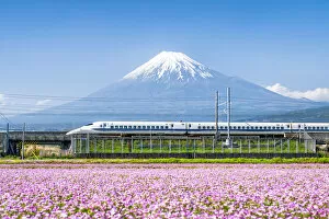 Japan Gallery: Tokaido Shinkansen bullet train passing by Mount Fuji, Yoshiwara, Shizuoka prefecture