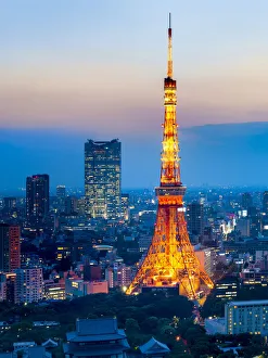 Tokyo Tower at night with view towards Roppongi hills and Mori Tower, Minato, Tokyo Tokyo Tower at night with view towards Roppongi hills and Mori Tower, Minato, Tokyo