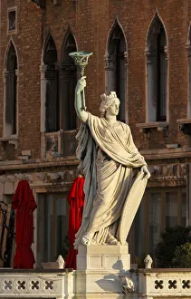 Torchbearer on the terrace the Bauer Palazzo, Venice, Veneto, Italy