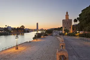 Southern Spain Prints: Torre del Oro (Tower of Gold) and river Guadalquivir at dusk, Seville, province of