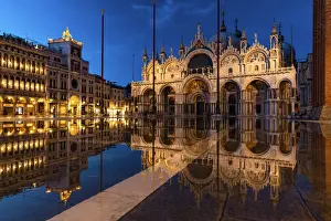 Torre dell Orologio and St Marks Basilica with high tide (acqua alta)